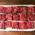 Gluten-free brownies with raspberry compote
